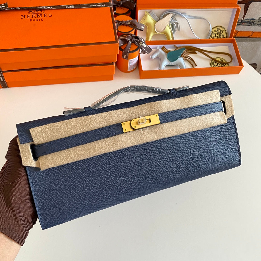 HERMES KELLY CUT 31 IN CLASSIC BLUE CALFSKIN WITH GOLD HARDWARE