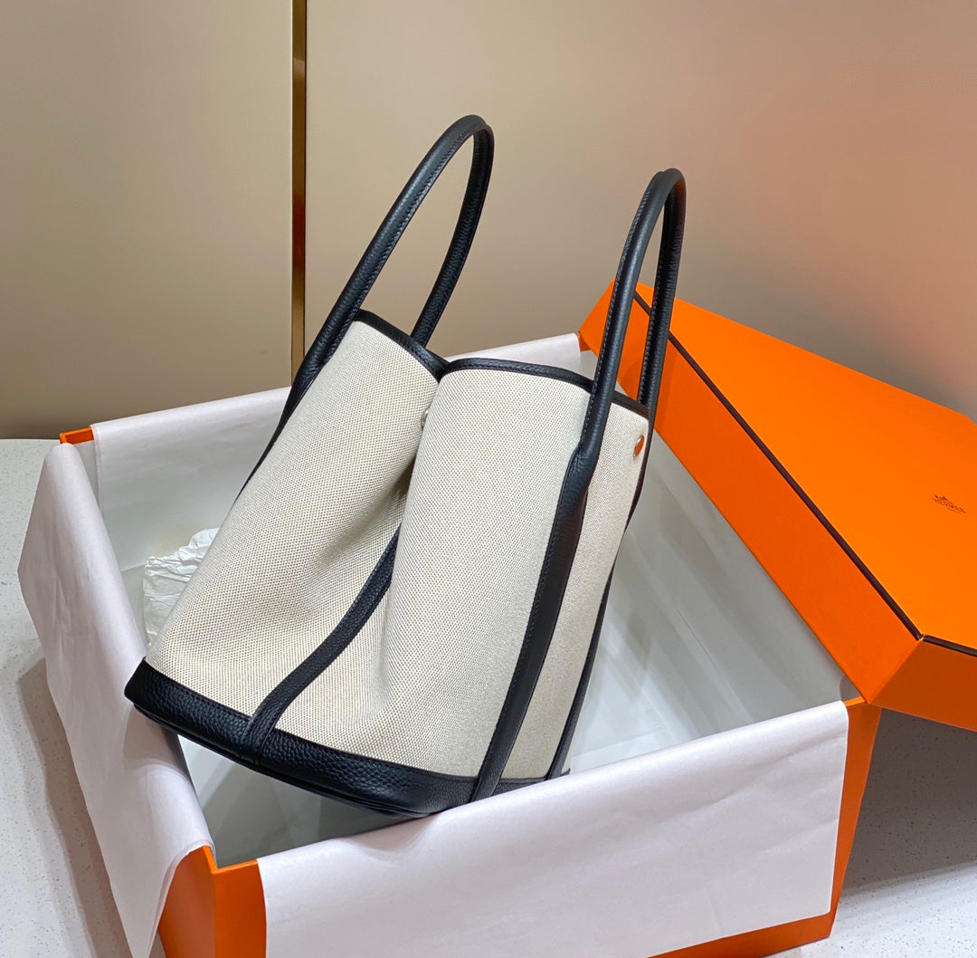 HERMES GARDEN PARTY 36CM IN WHITE TOILETS COTTON CANVAS AND BLACK CALFSKIN