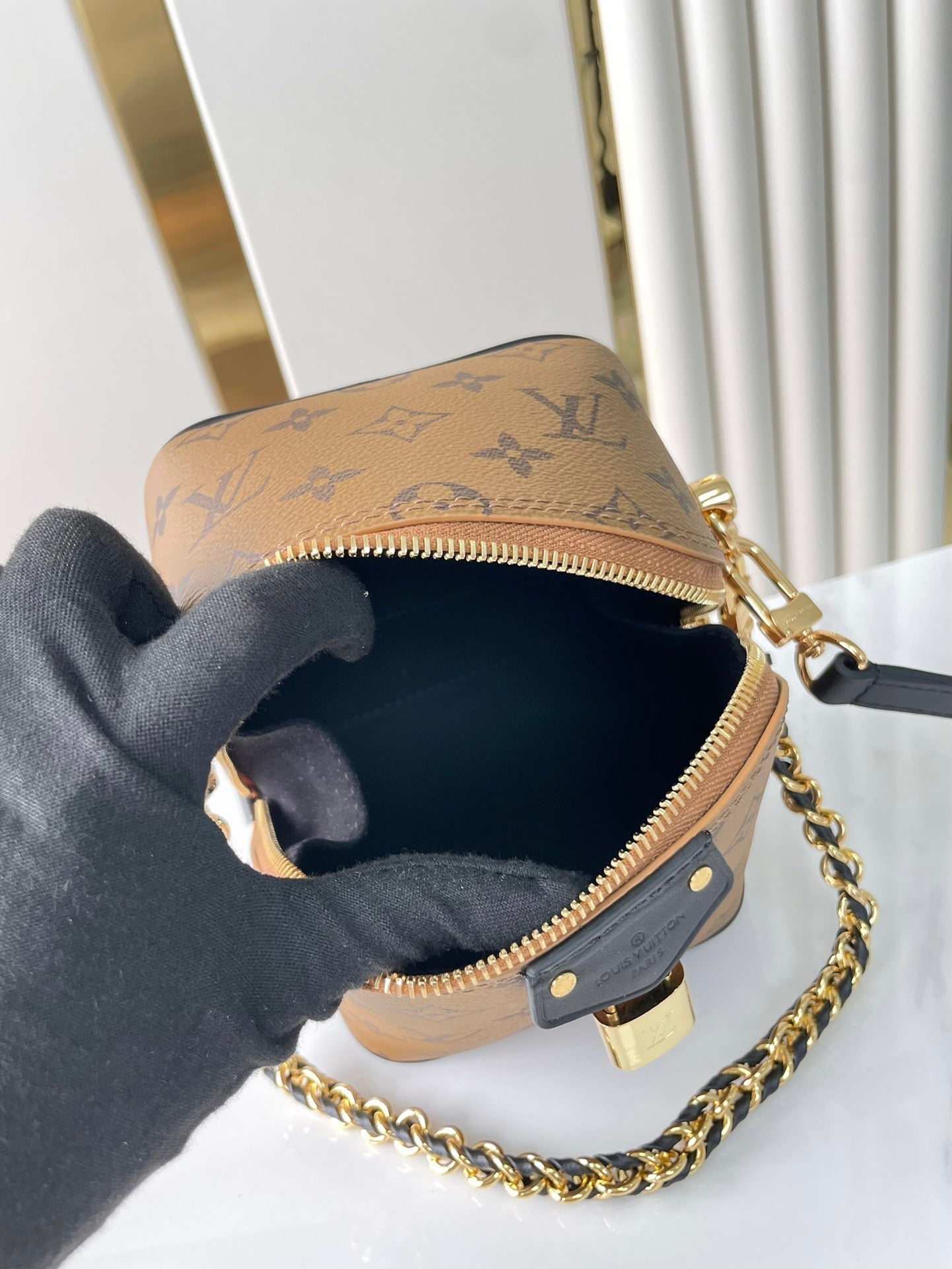 LOUIS VUITTON JUST IN CASE 14 IN BROWN MONOGRAM REVERSE CANVAS GOLD HARDWARE