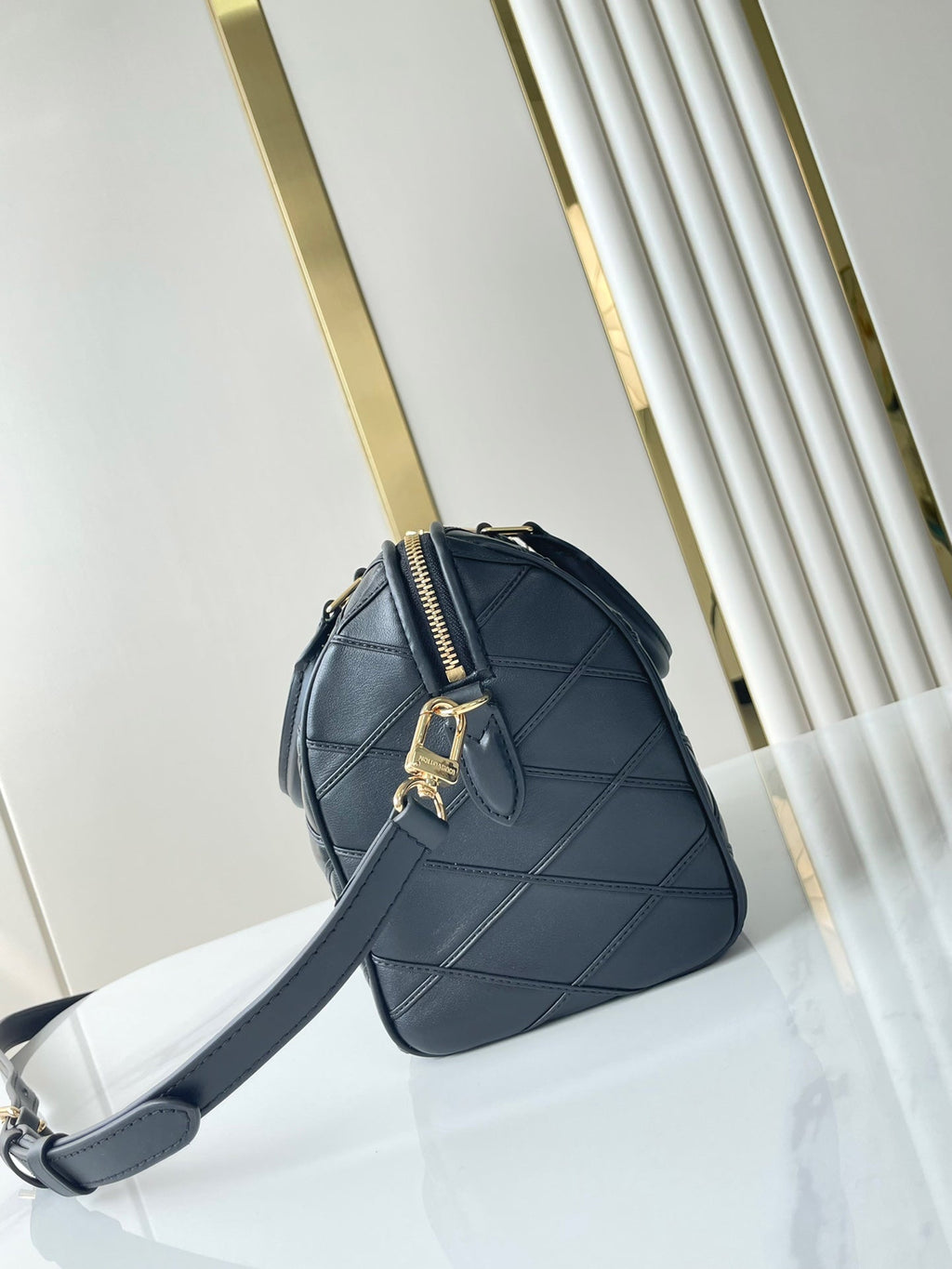 LOUIS VUITTON SPEEDY BANDOULIÈRE 25 WITH CRISS CROSS PATTERN IN BLACK LAMBSKIN