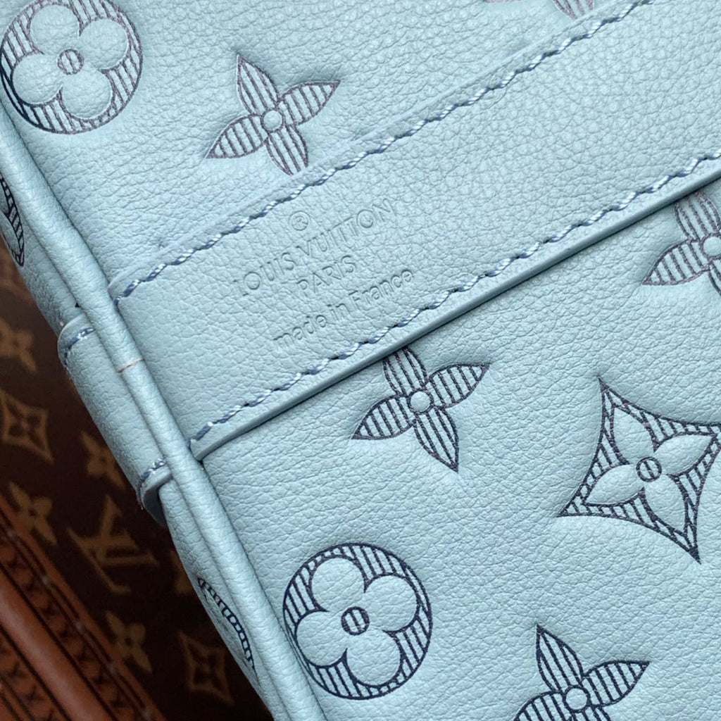 LOUIS VUITTON KEEPALL BANDOULIÈRE 50 IN SKY BLUE MONOGRAM SHADOW EMBOSSED CALFSKIN