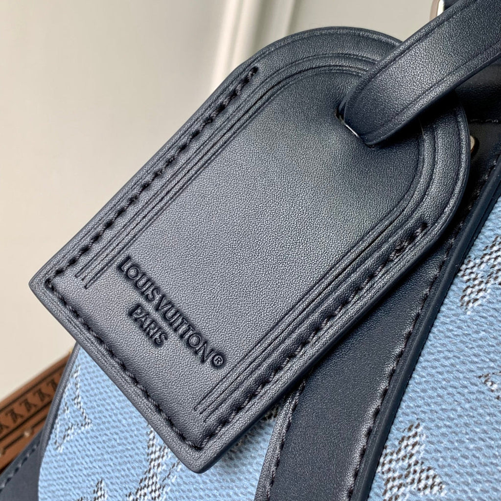 LOUIS VUITTON KEEPALL BANDOULIÈRE 25 INSKY BLUE MONOGRAM HERITAGE CANVAS DARK BLUE CALFSKIN