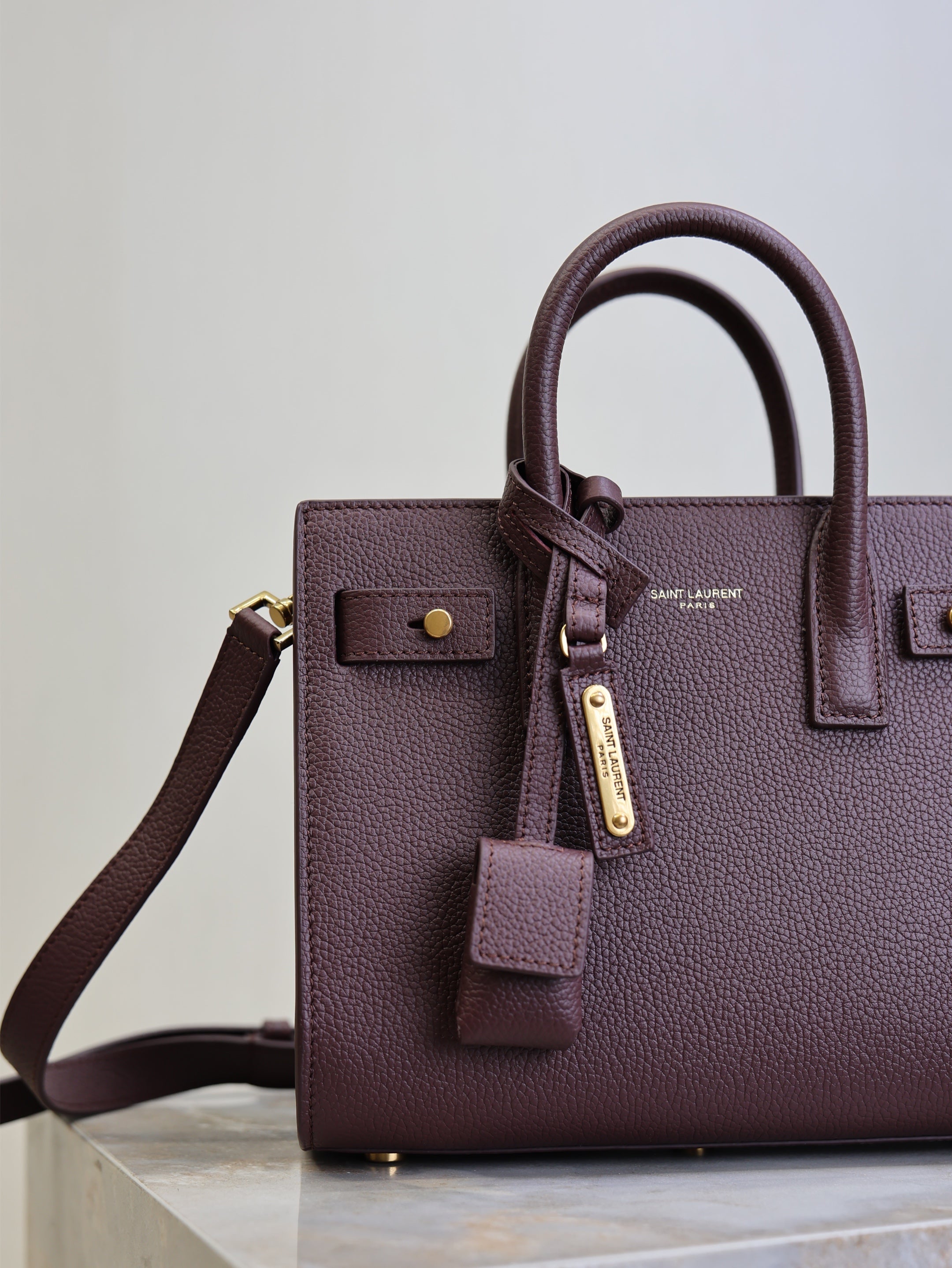 YSL 25S SAC DE JOUR 22 IN ROUGE CABERNET SUPPLE GRAINED CALFSKIN
