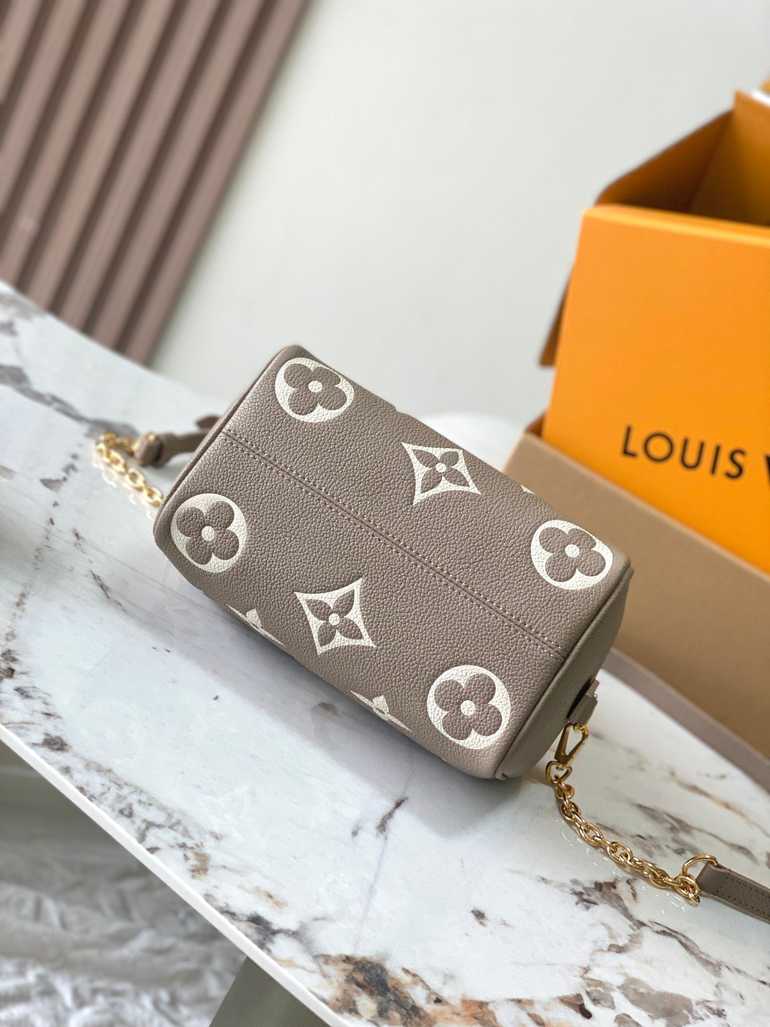 LOUIS VUITTON SPEEDY BANDOULIÈRE 20 IN TAUPE BROWN AND WHITE MONOGRAM EMPREINTE LEATHER
