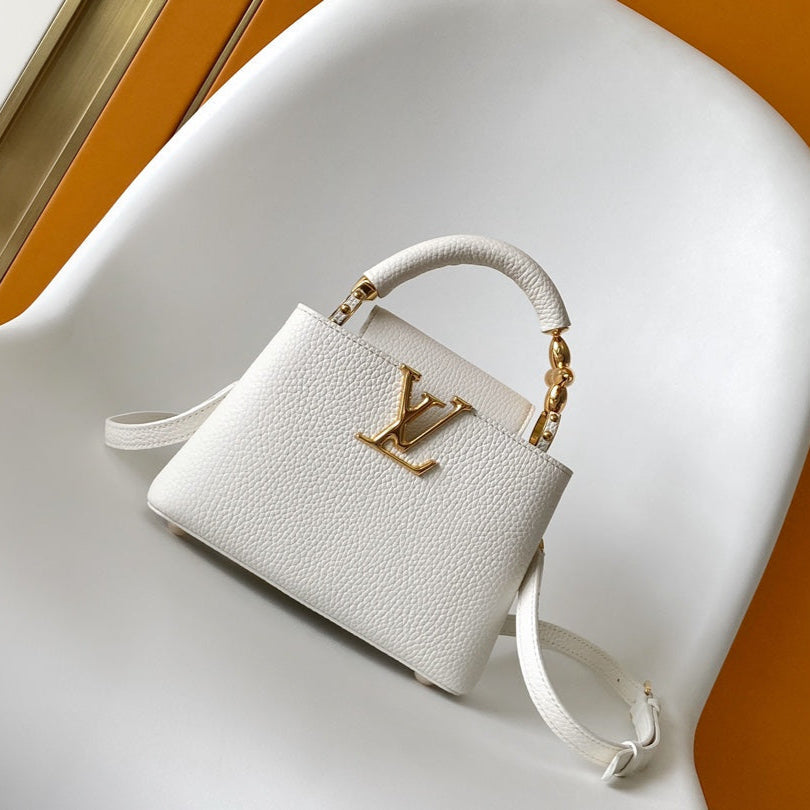 LOUIS VUITTON CAPUCINES EAST-WEST MINI 21 IN WHITE TAURILLON LEATHER GOLD-TONE HARDWARE