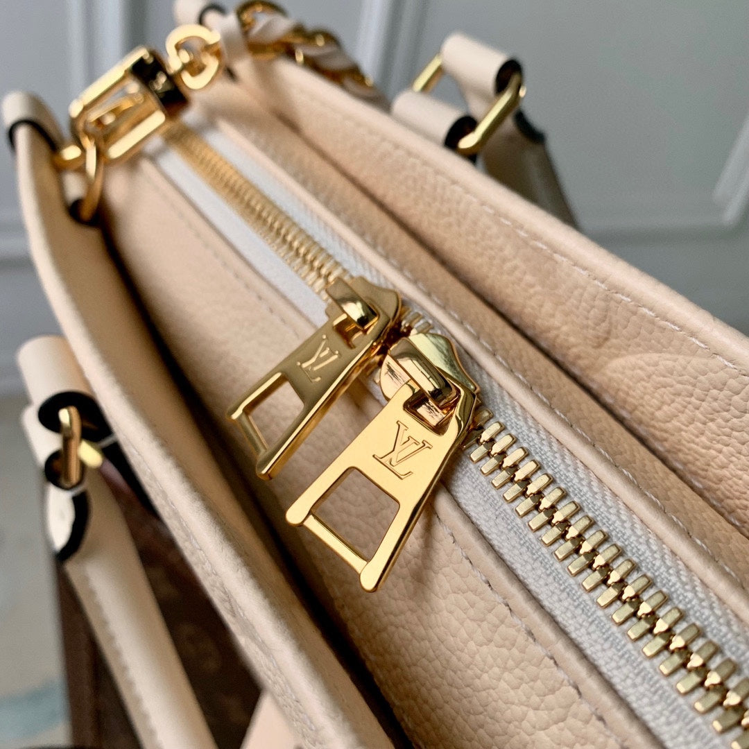 LOUIS VUITTON ONTHEGO EAST WEST BAG 25 IN BEIGE MONOGRAM EMBOSSED COWHIDE