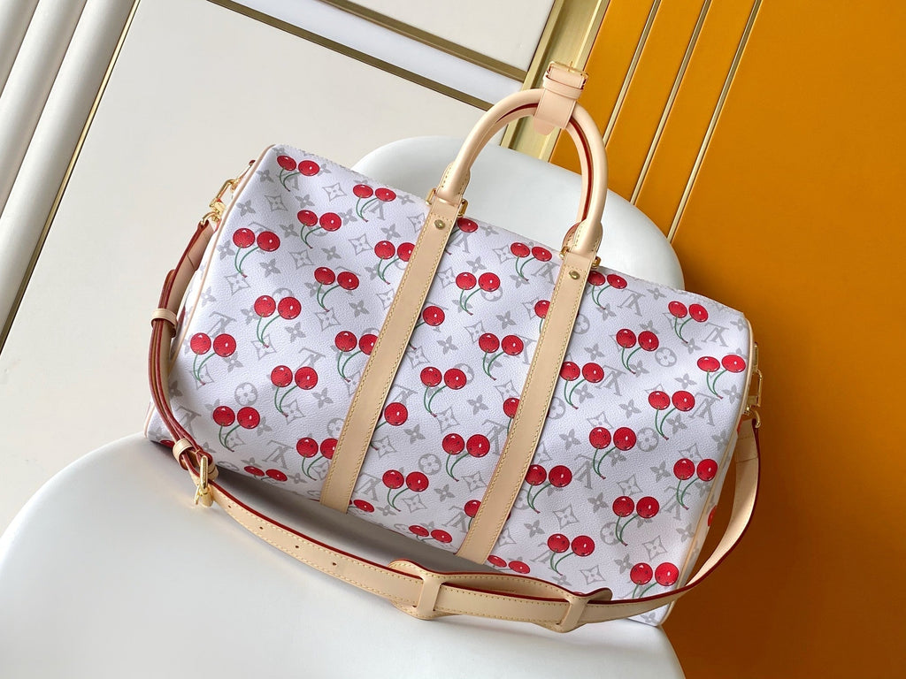 LOUIS VUITTON KEEPALL BANDOULIÈRE 45 IN WHITE AND RED CALFSKIN