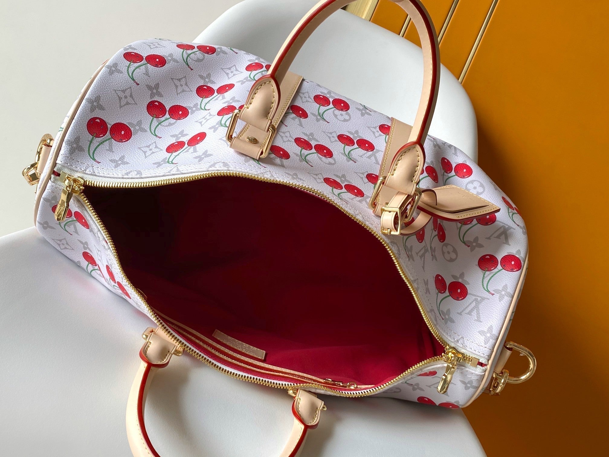 LOUIS VUITTON KEEPALL BANDOULIÈRE 45 IN WHITE AND RED CALFSKIN