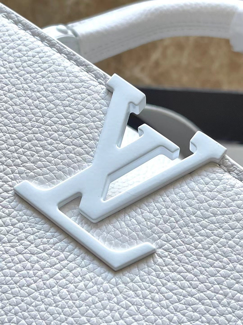 LOUIS VUITTON CAPUCINES EAST-WEST BB 27 IN WHITE TAURILLON