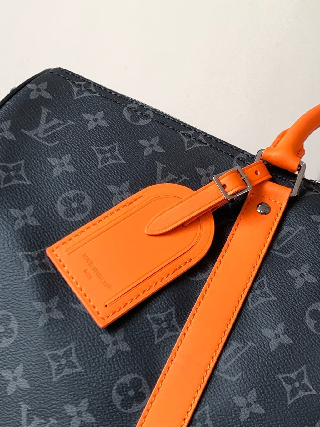 LOUIS VUITTON LV 25S KEEPALL 45 WITH SHOULDER STRAP IN BLACK ORANGE COATED MONOGRAM ECLIPSE CANVAS AND CALFSKIN