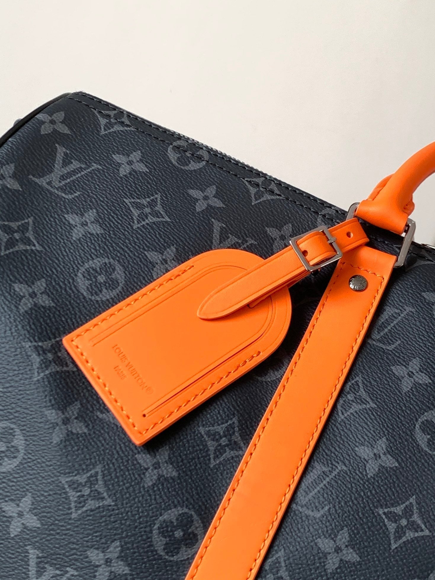 LOUIS VUITTON LV 25S KEEPALL 45 WITH SHOULDER STRAP IN BLACK ORANGE COATED MONOGRAM ECLIPSE CANVAS AND CALFSKIN