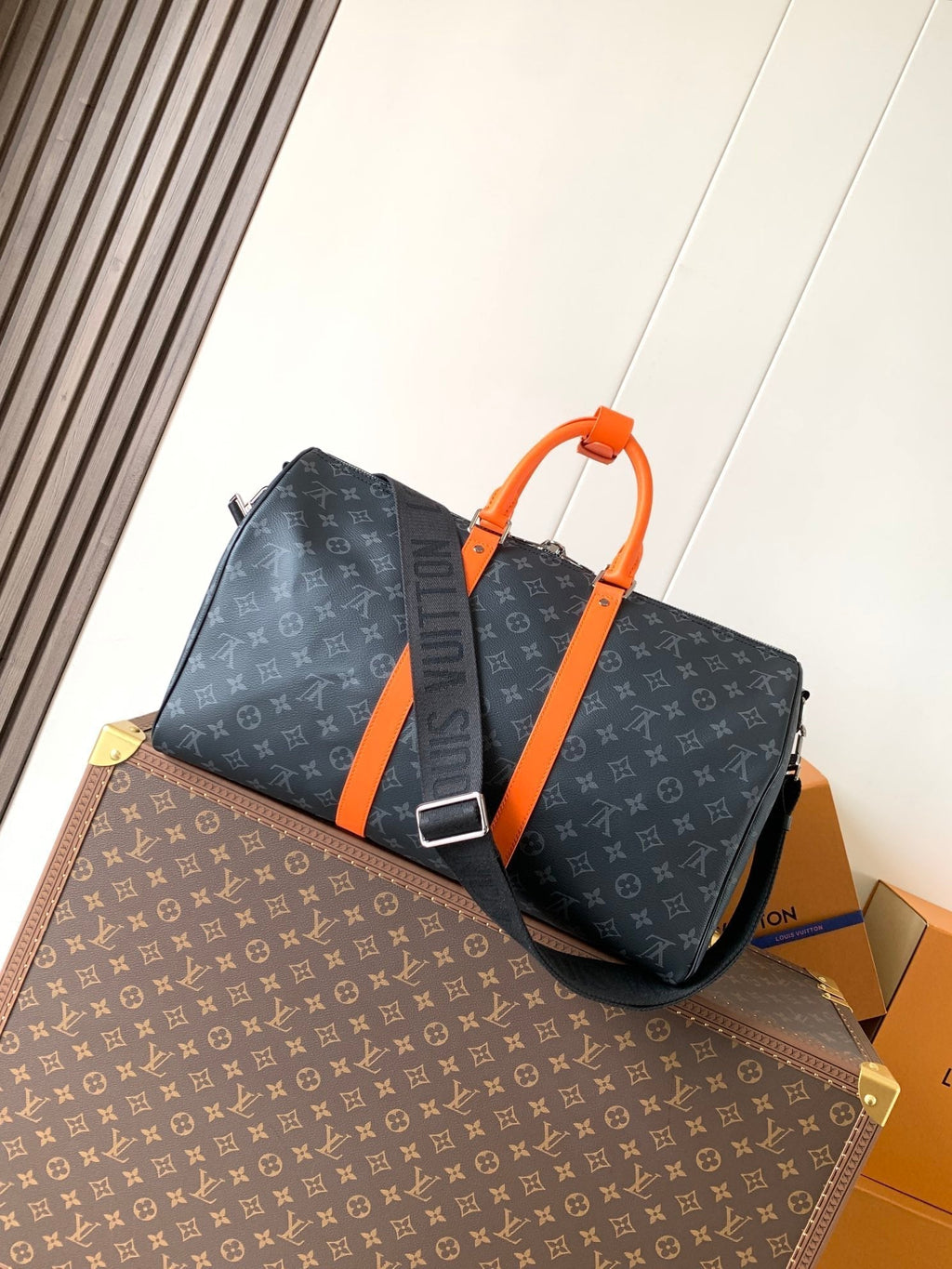 LOUIS VUITTON LV 25S KEEPALL 45 WITH SHOULDER STRAP IN BLACK ORANGE COATED MONOGRAM ECLIPSE CANVAS AND CALFSKIN