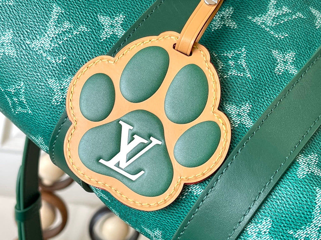 LOUIS VUITTON KEEPALL BANDOULIÈRE 25 IN GREEN MONOGRAM HERITAGE CANVAS