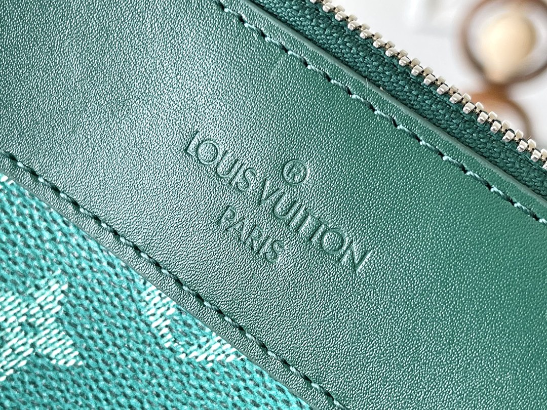 LOUIS VUITTON POCHETTE VOYAGE SOUPLE 32 IN GREEN MONOGRAM HERITAGE CANVAS