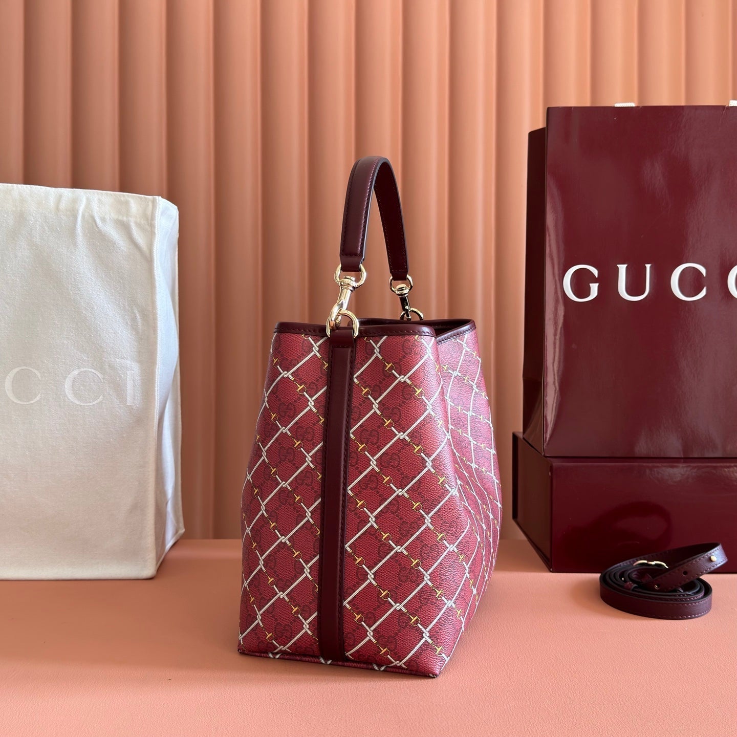 GUCCI 26S  EMBLEM BUCKET BAG 25 IN DARK RED COATED FABRIC