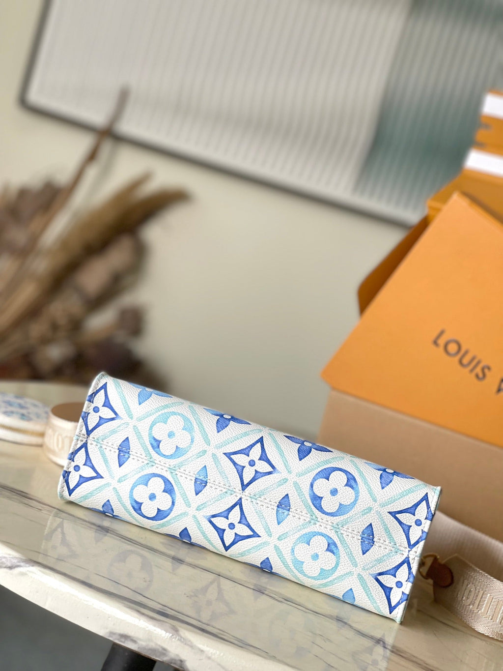 LOUIS VUITTON ONTHEGO EAST WEST 25 IN LAGOON BLUE MONOGRAM TILES CANVAS