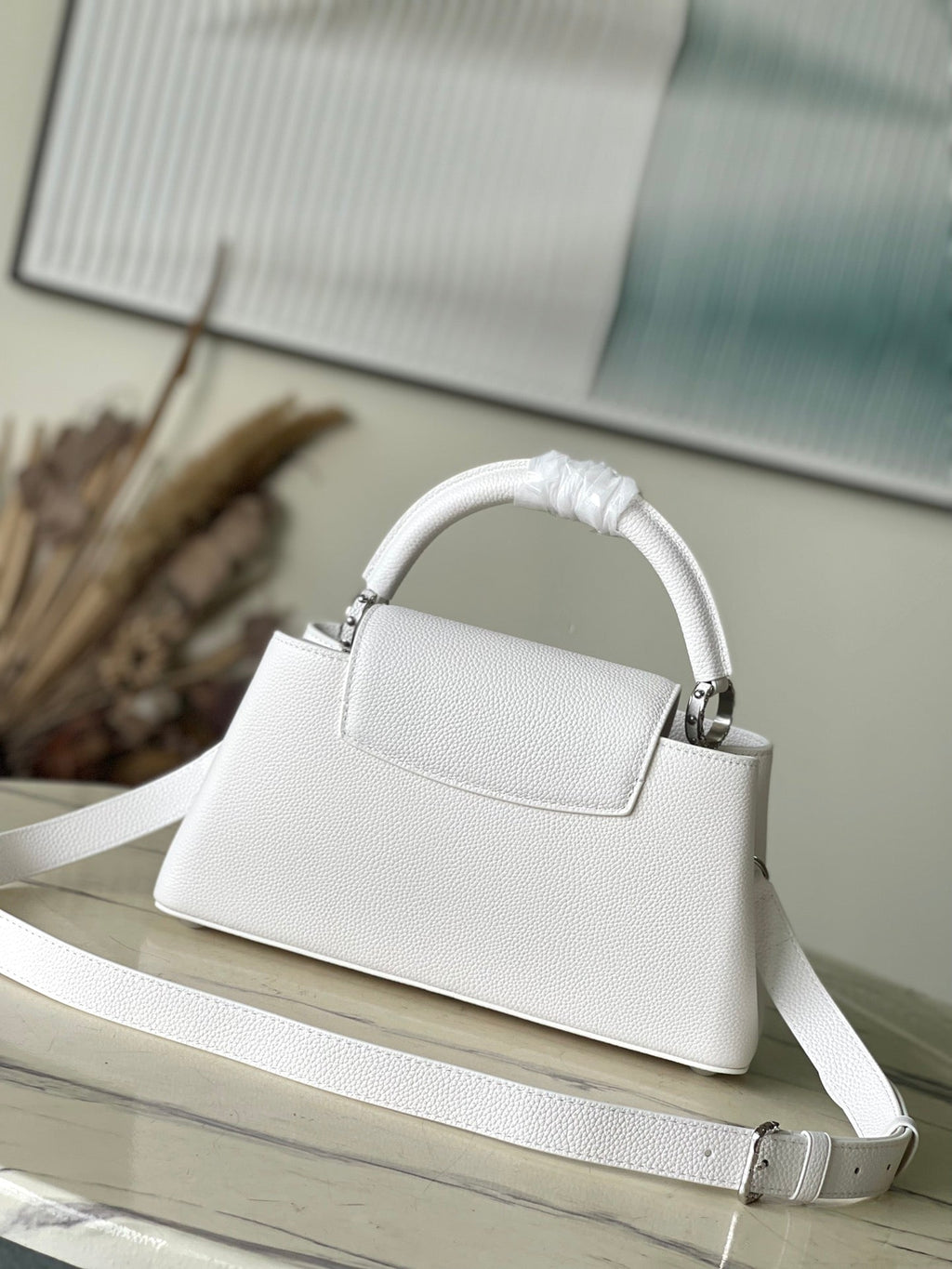 LOUIS VUITTON CAPUCINES EAST-WEST 33 IN WHITE CALFSKIN SILVER HARDWARE