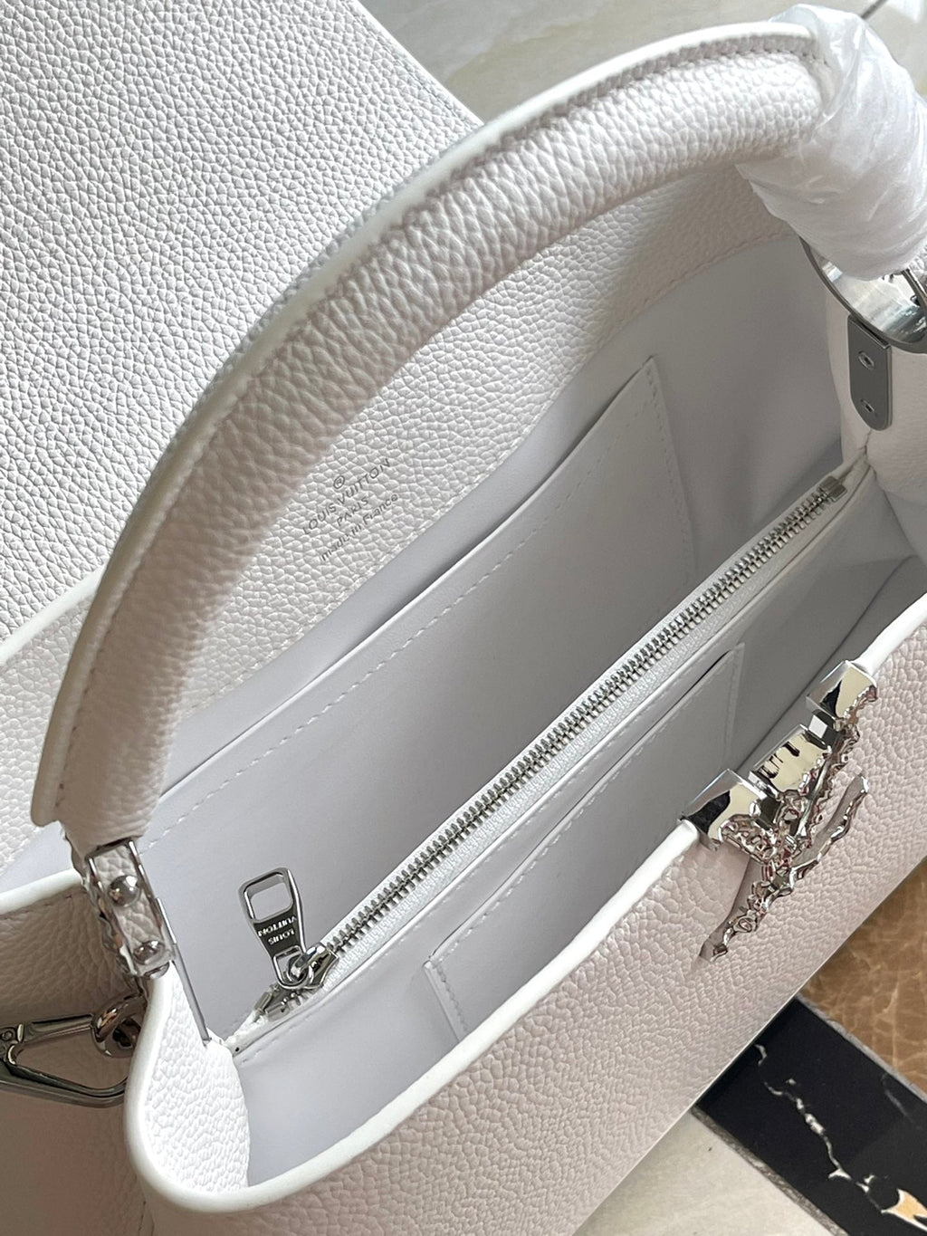 LOUIS VUITTON CAPUCINES EAST-WEST 33 IN WHITE CALFSKIN SILVER HARDWARE