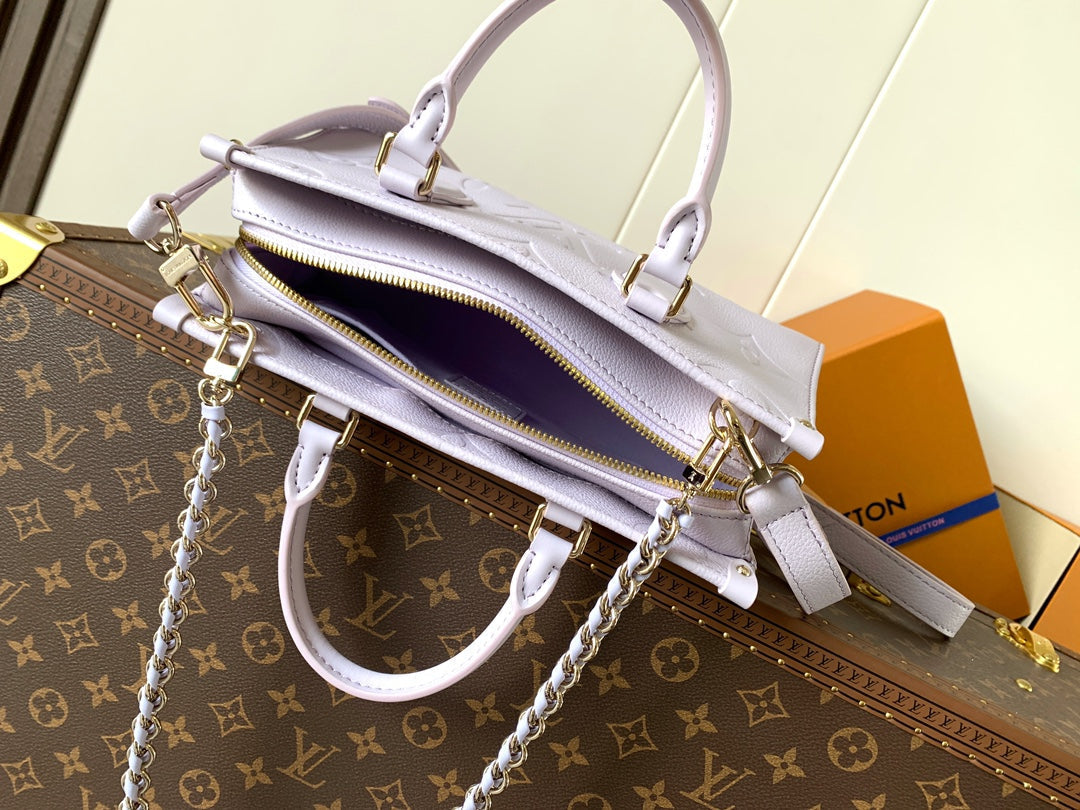 LOUIS VUITTON LV 25S ONTHEGO EAST WEST BAG 25 IN LIGHT LAVENDER CALFSKIN MONOGRAM EMPREINTE