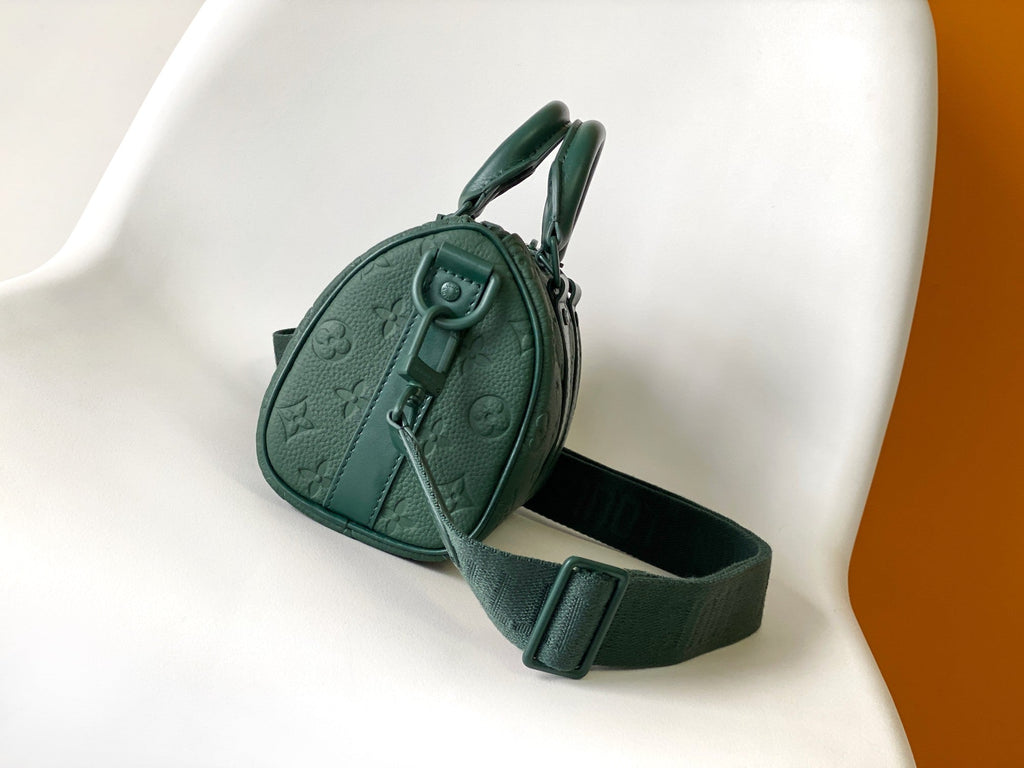 LOUIS VUITTON KEEPALL BANDOULIÈRE 25 IN FOREST GREEN MONOGRAM EMBOSSED CALFSKIN